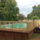 Outdoor Living Space - Wrap around wood deck for above ground pool
