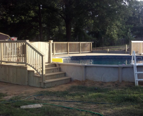 Hide your above ground pool with a custom wood deck and turn your backyard into a luxury outdoor living space.