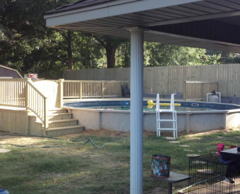 Hide your above ground pool with a custom wood deck and turn your backyard into a luxury outdoor living space.